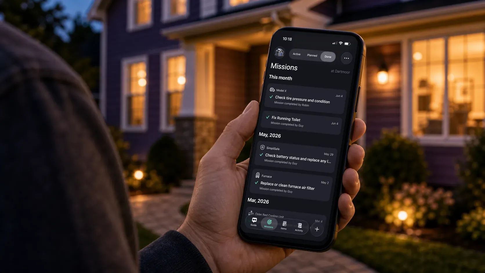 A person viewing completed home missions in Mudroom while standing outside a warmly lit home